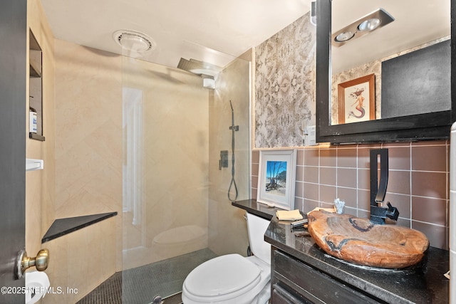 118 Herja Acre Ln, Palatka, FL 32177 - bathroom featuring tile walls, a walk in shower, toilet, and vanity