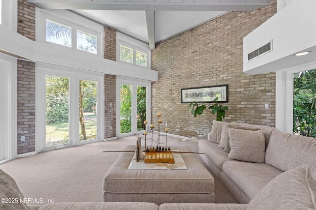 118 Herja Acre Ln, Palatka, FL 32177 - carpeted living room with a high ceiling and brick wall