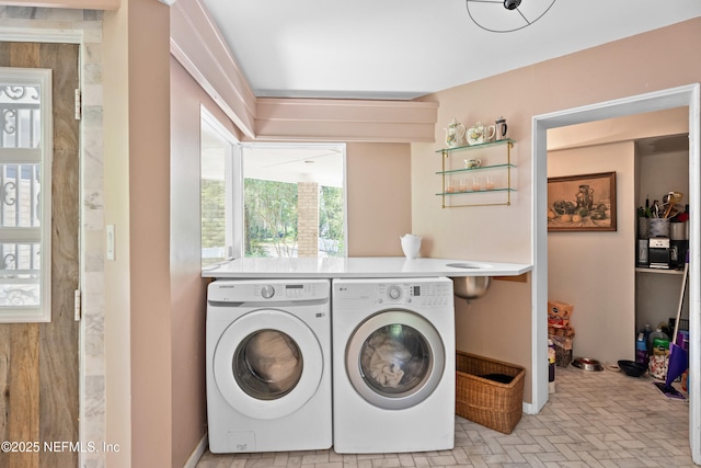 118 Herja Acre Ln, Palatka, FL 32177 - washroom featuring washer and dryer, brick patterned flooring, and baseboards
