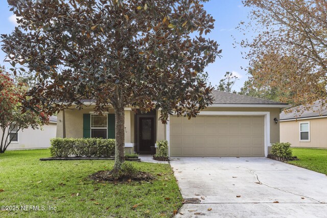 217 N Twin Maple Rd, Saint Augustine, FL 32084 - view of front of property featuring stucco siding, driveway, a front yard, and an attached garage