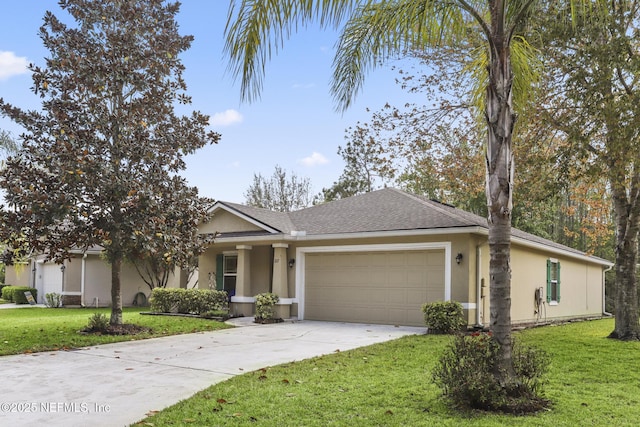 217 N Twin Maple Rd, Saint Augustine, FL 32084 - ranch-style home featuring stucco siding, a garage, roof with shingles, a front yard, and concrete driveway