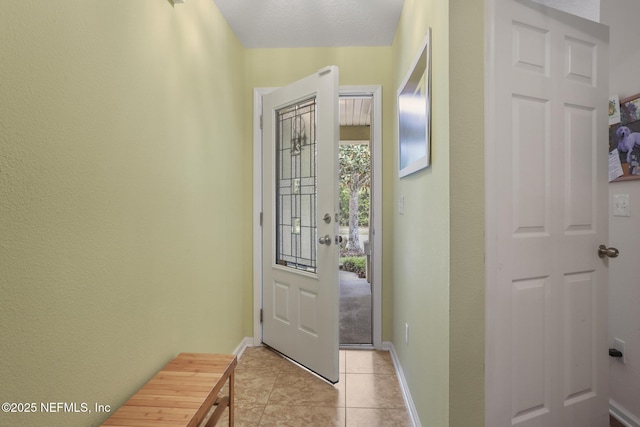 217 N Twin Maple Rd, Saint Augustine, FL 32084 - doorway to outside featuring light tile patterned floors and baseboards