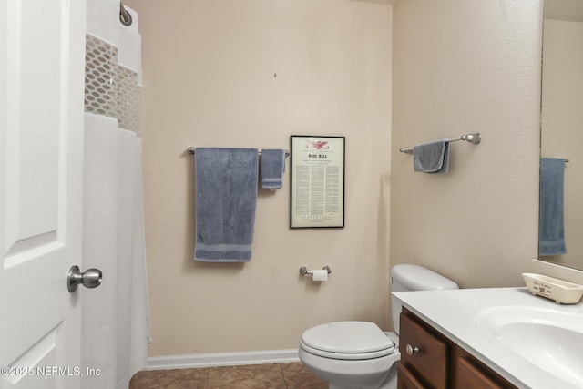 217 N Twin Maple Rd, Saint Augustine, FL 32084 - full bath featuring baseboards, toilet, tile patterned flooring, and vanity