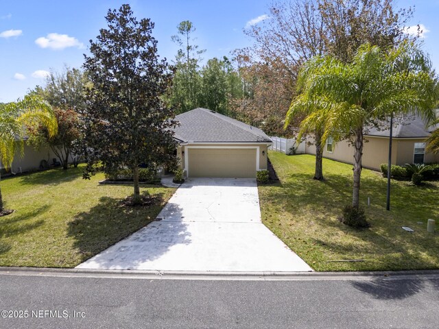 217 N Twin Maple Rd, Saint Augustine, FL 32084 - view of front of property with driveway, a front lawn, and an attached garage