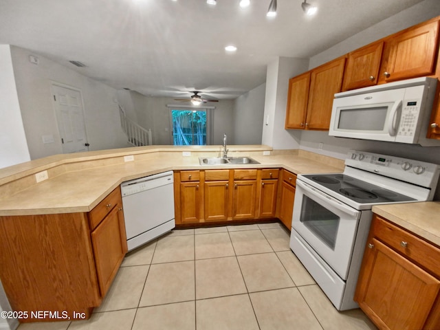 8550 Argyle Business Loop Unit 903, Jacksonville, FL 32244 - kitchen featuring brown cabinets, white appliances, light countertops, and a sink