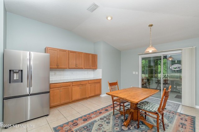 4917 Cypress Links Blvd, Elkton, FL 32033 - dining room with lofted ceiling and light tile patterned floors