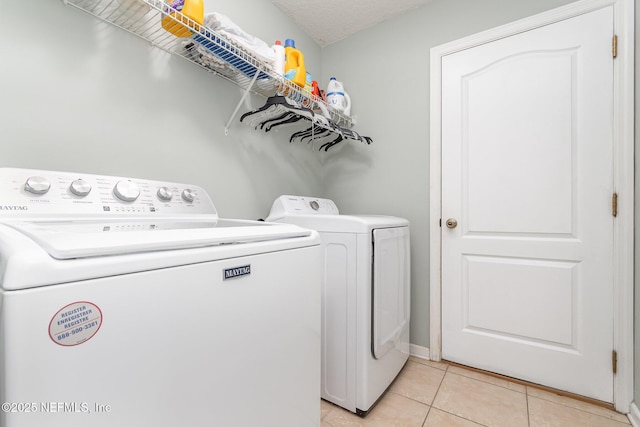4917 Cypress Links Blvd, Elkton, FL 32033 - laundry area with washing machine and clothes dryer and light tile patterned floors