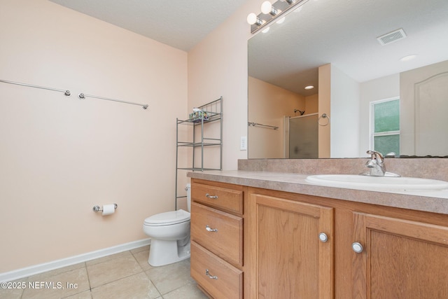 4917 Cypress Links Blvd, Elkton, FL 32033 - bathroom featuring tile patterned flooring, vanity, a shower with shower door, toilet, and baseboards