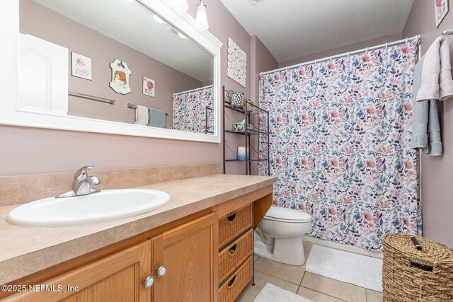 4917 Cypress Links Blvd, Elkton, FL 32033 - bathroom with vanity, toilet, tile patterned floors, a textured ceiling, and curtained shower