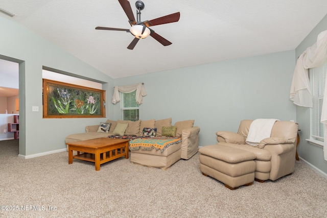 4917 Cypress Links Blvd, Elkton, FL 32033 - living area featuring carpet flooring, ceiling fan, vaulted ceiling, and baseboards