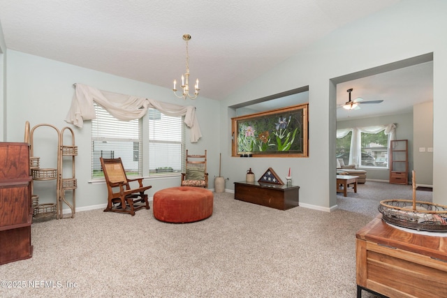4917 Cypress Links Blvd, Elkton, FL 32033 - living area with carpet floors, a chandelier, lofted ceiling, ceiling fan, and baseboards