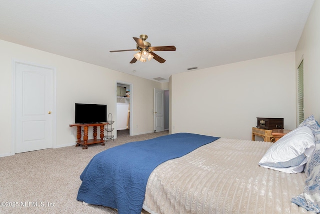 4917 Cypress Links Blvd, Elkton, FL 32033 - bedroom with carpet floors, ceiling fan, a walk in closet, and baseboards
