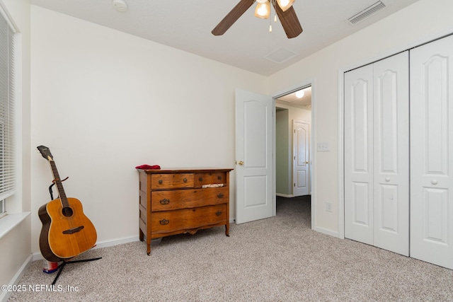 4917 Cypress Links Blvd, Elkton, FL 32033 - bedroom with light colored carpet, a closet, baseboards, and ceiling fan
