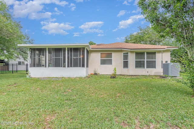 4917 Cypress Links Blvd, Elkton, FL 32033 - back of property with a sunroom, central air condition unit, and stucco siding