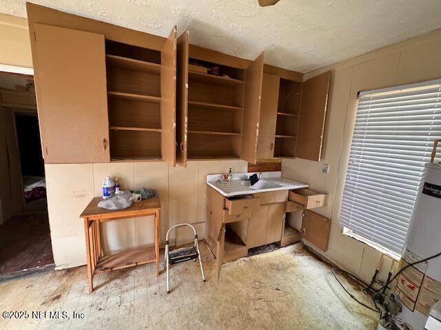 unfurnished office featuring a textured ceiling