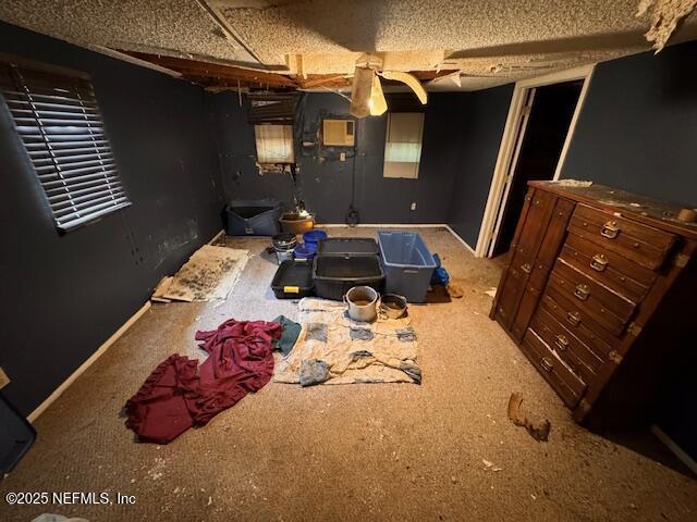 carpeted bedroom featuring baseboards