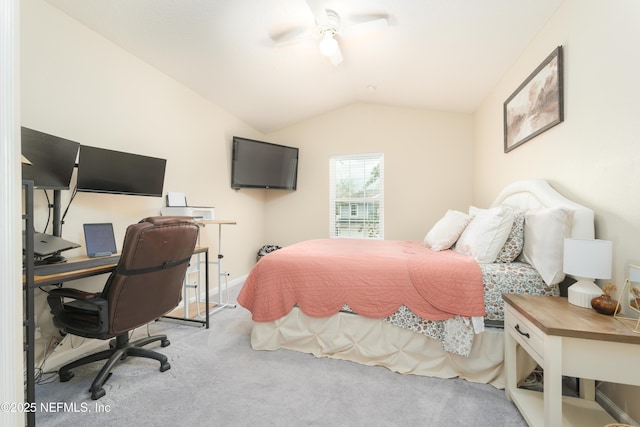 bedroom featuring a ceiling fan, carpet floors, and vaulted ceiling