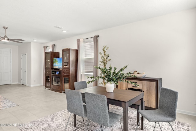 dining space with ceiling fan, baseboards, light tile patterned flooring, and recessed lighting