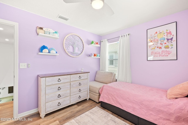 bedroom featuring wood finished floors and a ceiling fan