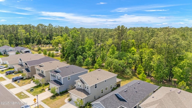 aerial perspective of suburban area with a forest