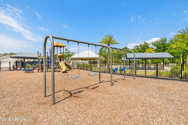 community jungle gym featuring fence