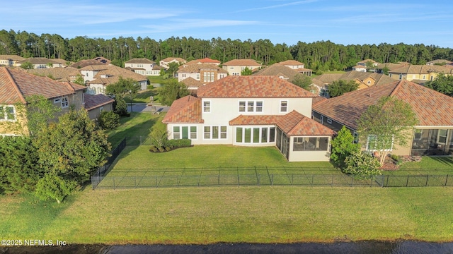 birds eye view of property with a residential view