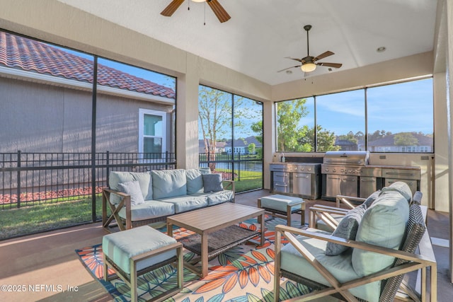 sunroom with ceiling fan, an outdoor hangout area, and vaulted ceiling