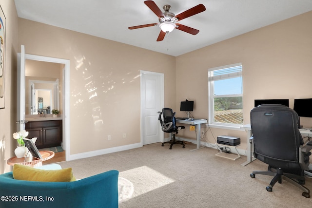 office space with ceiling fan, baseboards, and carpet floors