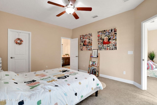 bedroom with connected bathroom, ceiling fan, visible vents, baseboards, and light carpet