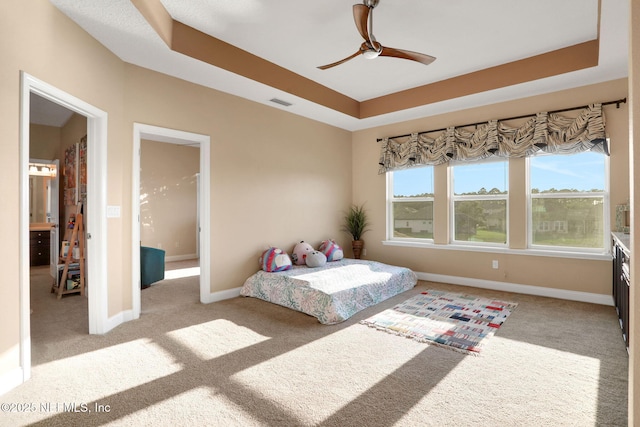 bedroom featuring visible vents, a ceiling fan, carpet flooring, and baseboards