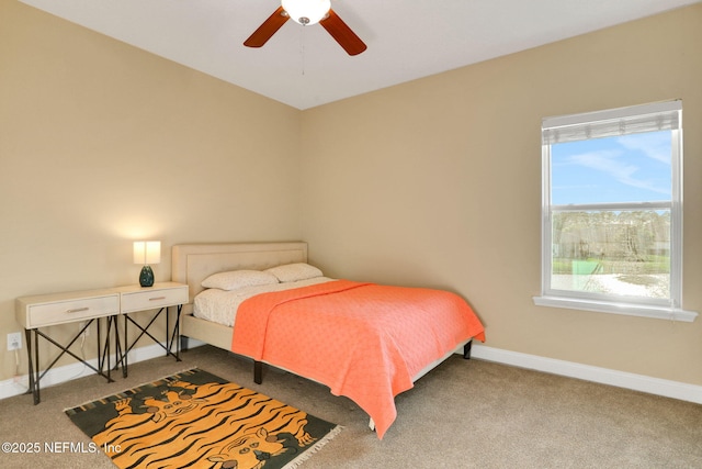 bedroom with baseboards, carpet floors, and multiple windows