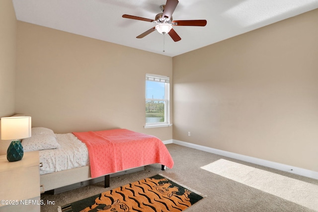 bedroom featuring baseboards, a ceiling fan, and carpet