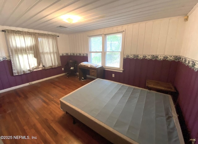 bedroom with wood finished floors