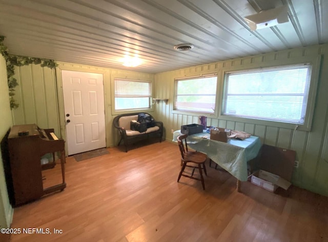 dining area featuring visible vents and light wood-style floors