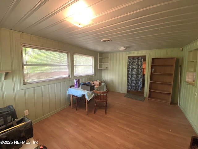 dining room featuring visible vents, wood ceiling, and wood finished floors
