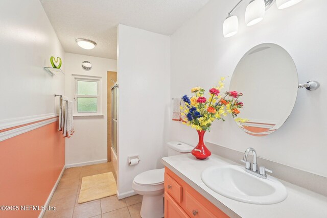 4518 Mountain Brook Ln E, Jacksonville, FL 32224 - bathroom with tile patterned floors, vanity, and bath / shower combo with glass door
