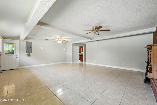 unfurnished living room featuring a textured ceiling, ceiling fan, baseboards, and light tile patterned flooring