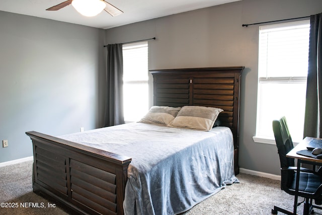 bedroom featuring baseboards, a ceiling fan, and carpet