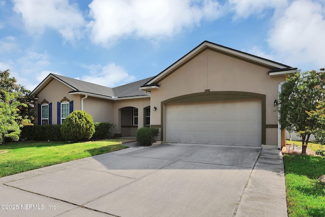 11459 Glenlaurel Oaks Cir, Jacksonville, FL 32257 - ranch-style home featuring an attached garage, a front lawn, driveway, and stucco siding