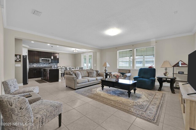 11459 Glenlaurel Oaks Cir, Jacksonville, FL 32257 - living area with ornamental molding, light tile patterned floors, and visible vents