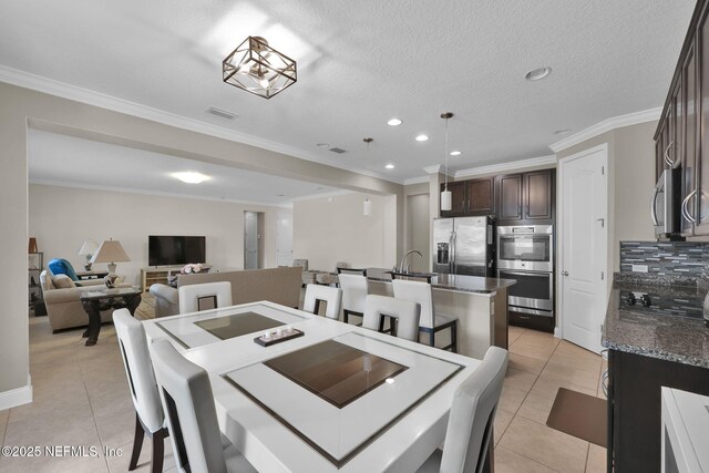 11459 Glenlaurel Oaks Cir, Jacksonville, FL 32257 - dining room featuring light tile patterned flooring, visible vents, recessed lighting, and crown molding