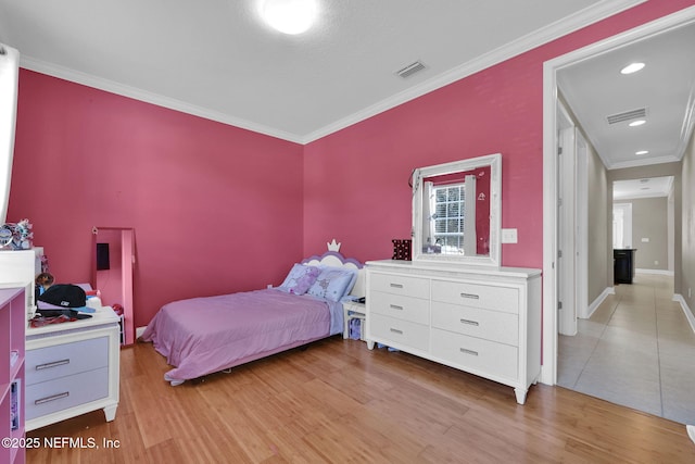 11459 Glenlaurel Oaks Cir, Jacksonville, FL 32257 - bedroom with crown molding, light wood finished floors, and visible vents