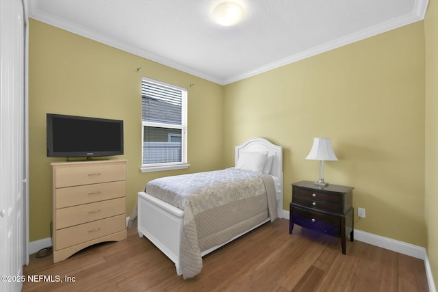 11459 Glenlaurel Oaks Cir, Jacksonville, FL 32257 - bedroom with baseboards, wood finished floors, and crown molding