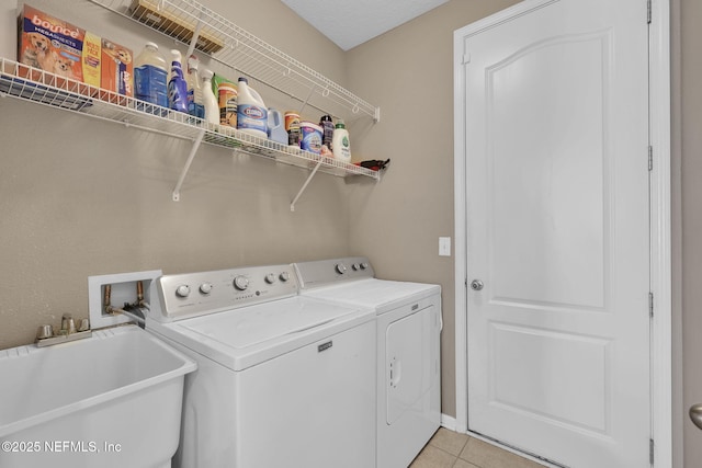 11459 Glenlaurel Oaks Cir, Jacksonville, FL 32257 - laundry area featuring light tile patterned floors, independent washer and dryer, laundry area, and a sink