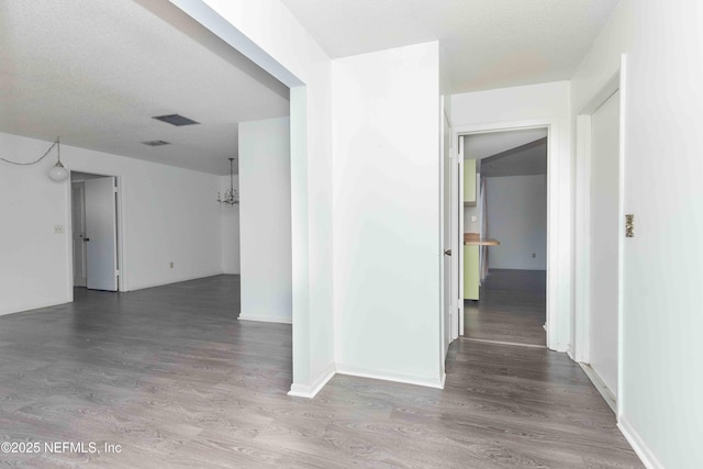 hallway with wood finished floors