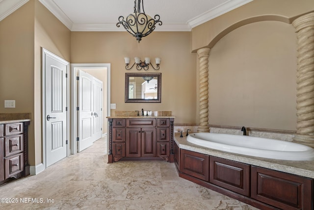 full bath featuring vanity, decorative columns, crown molding, and a chandelier