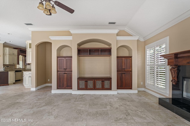 unfurnished living room featuring baseboards, visible vents, ornamental molding, and ceiling fan