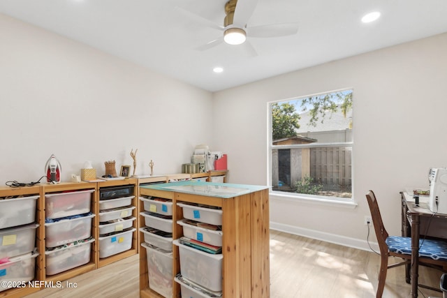 interior space with ceiling fan