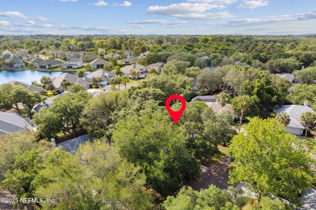 birds eye view of property featuring a residential view and a forest view