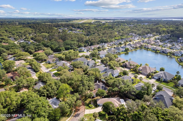 birds eye view of property with a residential view, a water view, and a forest view